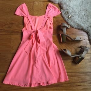 Bright pink cap sleeve dress with open back